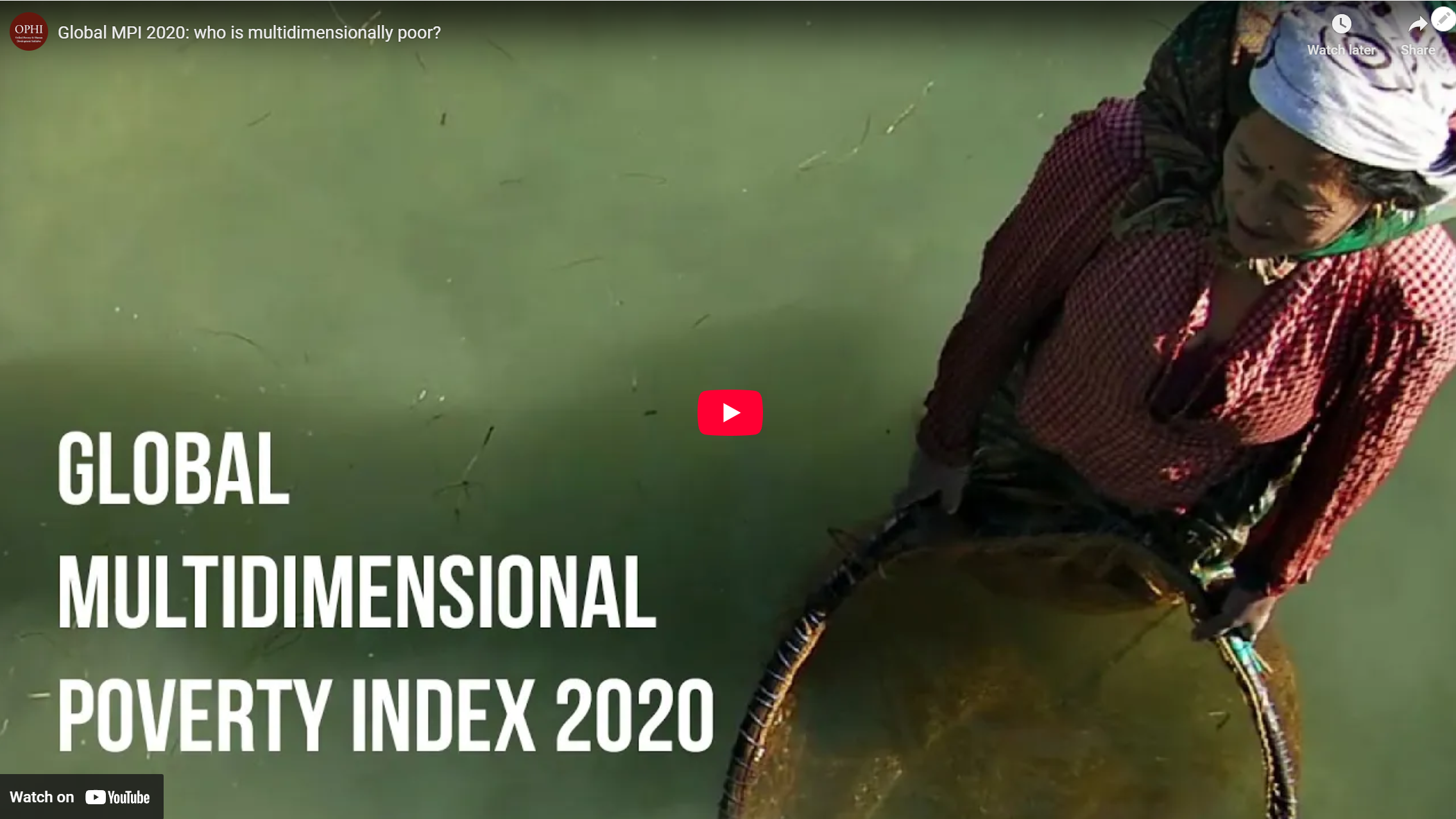 Screenshot of video showing woman standing in water with a basket