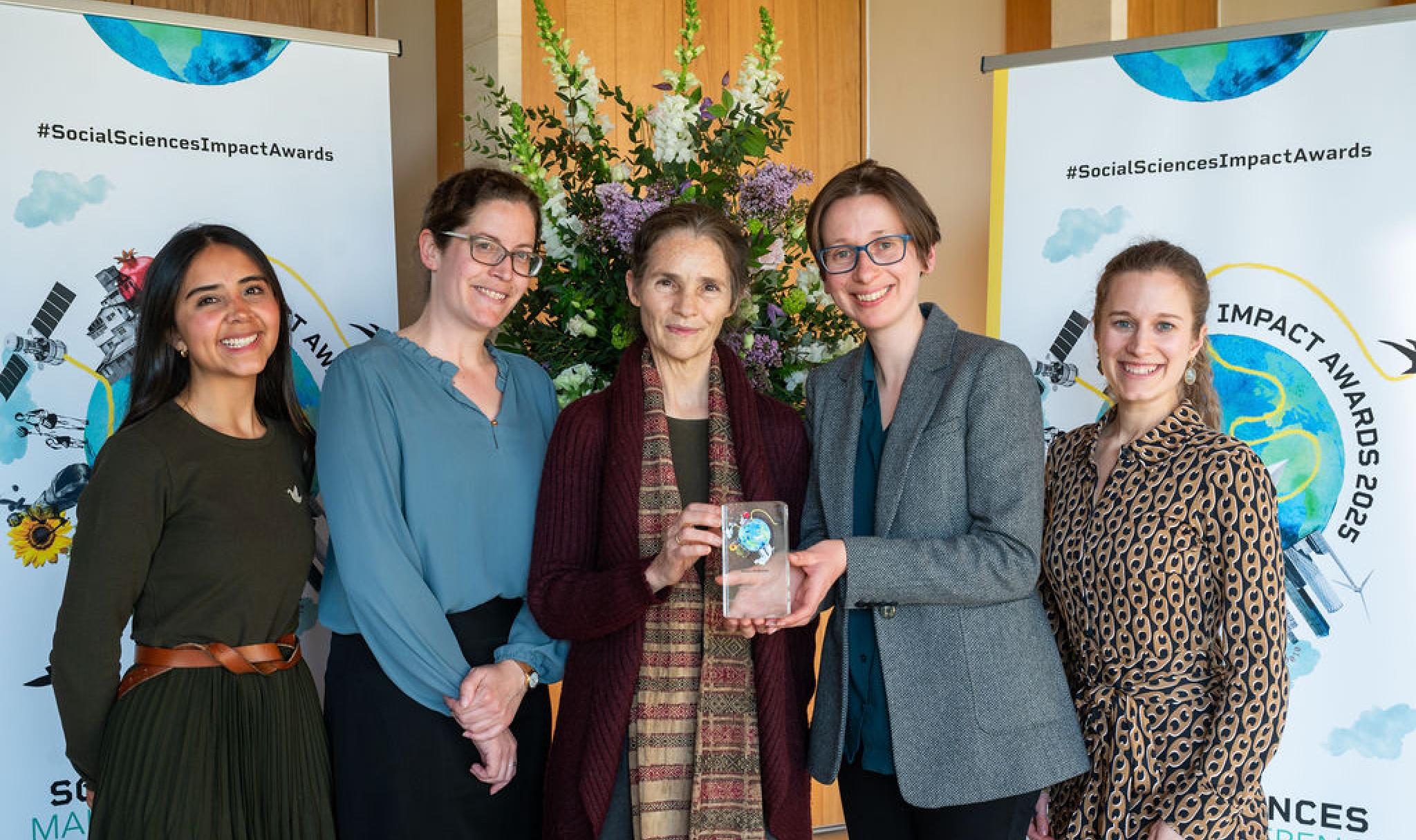 OPHI team collect award