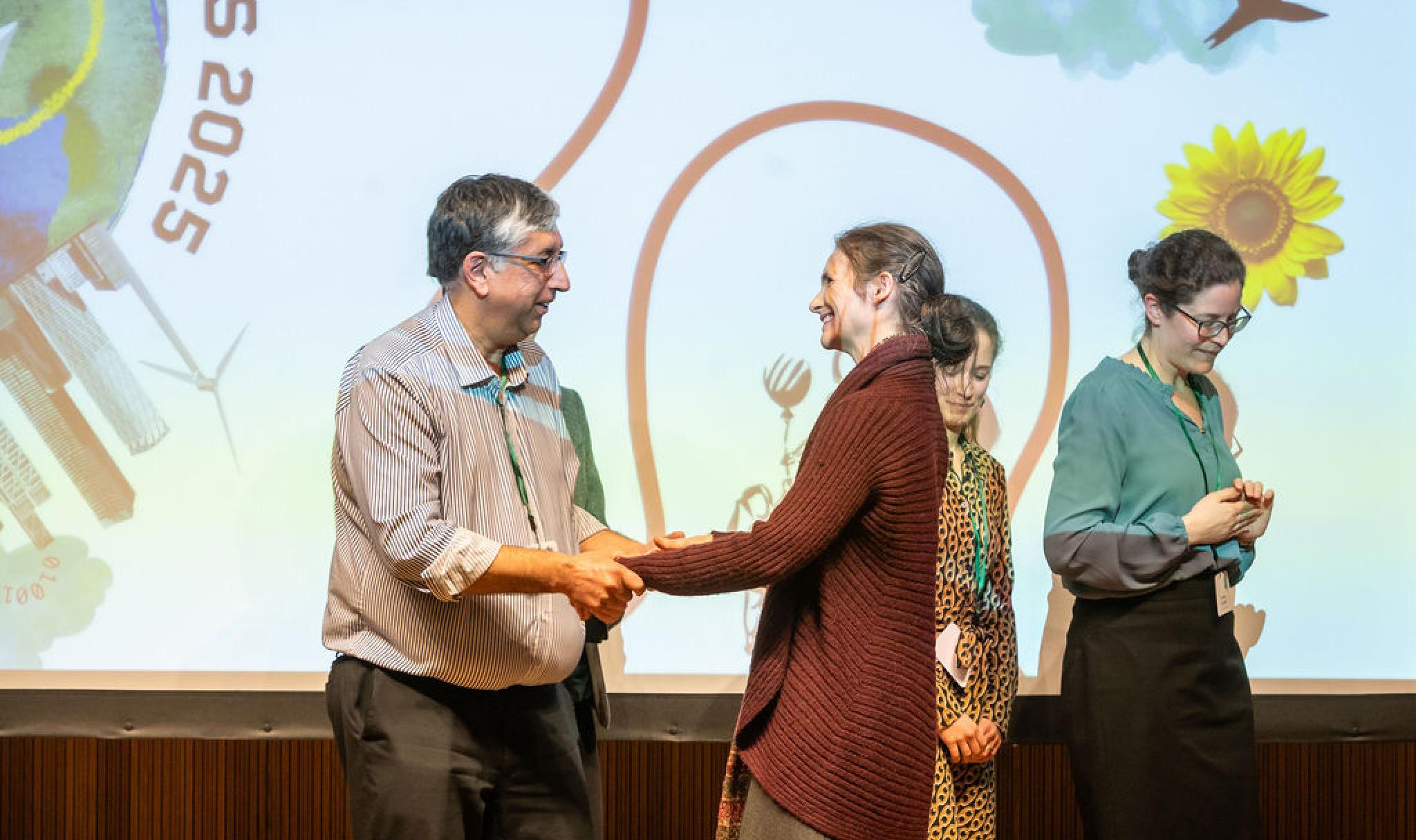 Sabina Alkire and the OPHI team collect the award